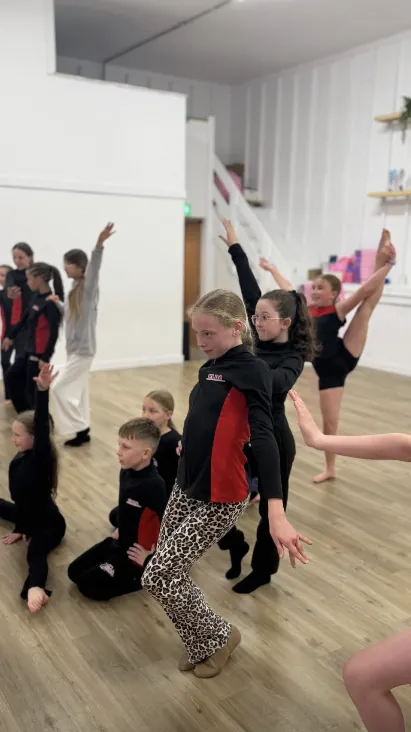 A group of ELDA dancers mid-phrase in a lyrical routine