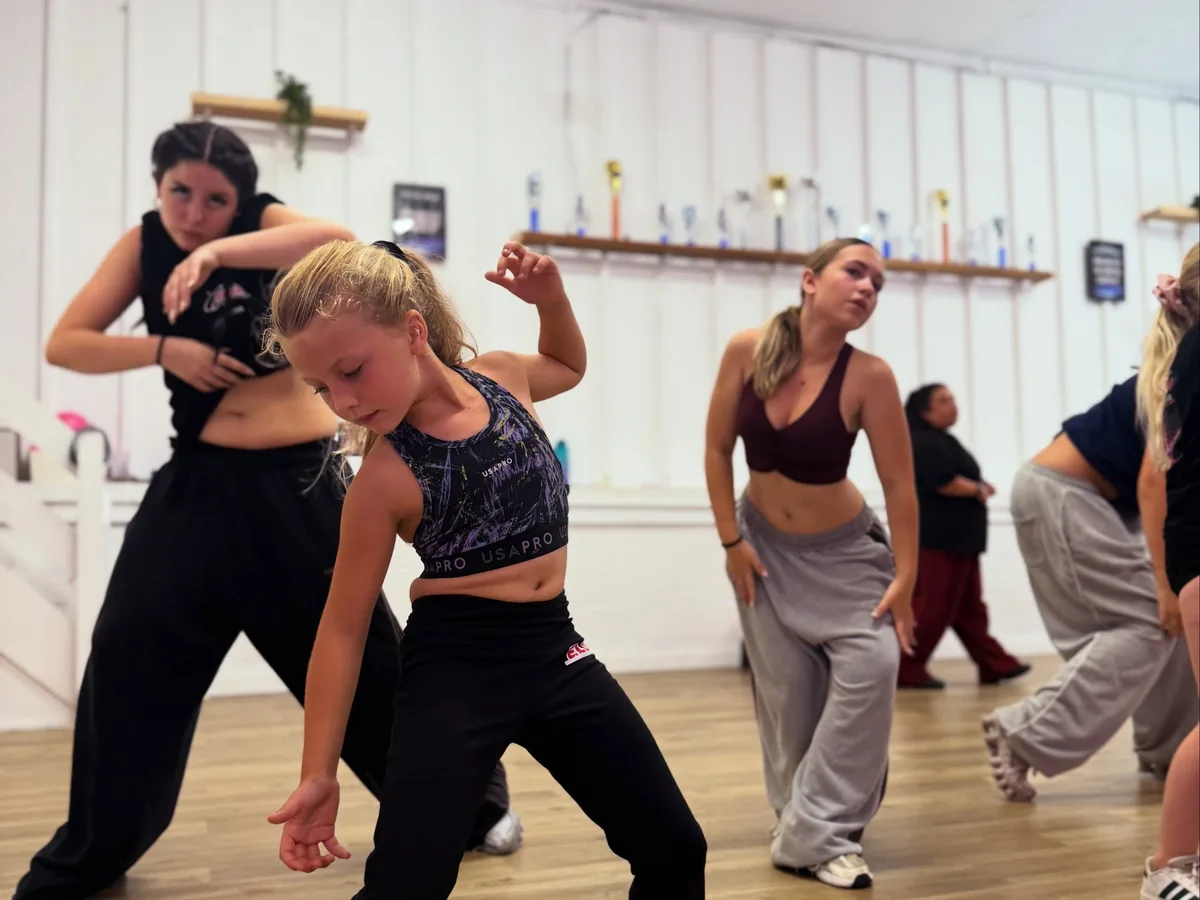 Seniors mid-routine in a street and commercial class